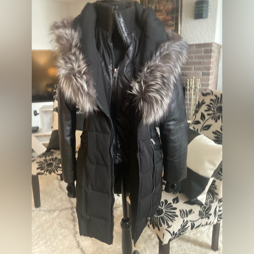 Sicily down coat with fur trimmed hood.